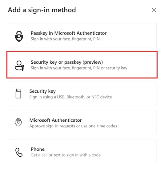 The Add a sign-in method dialog with Security key or passkey outlined in red.